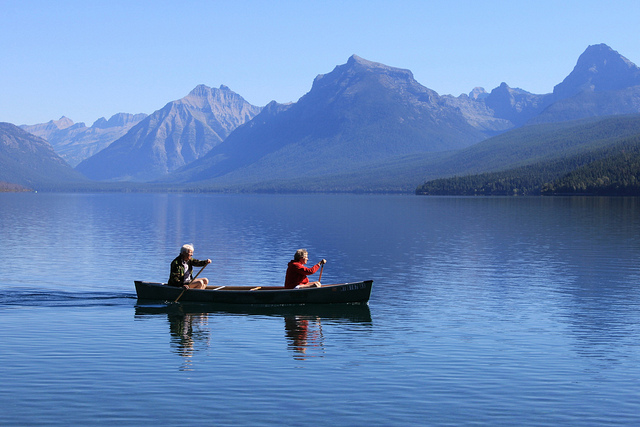 Couple Rowing on Lake