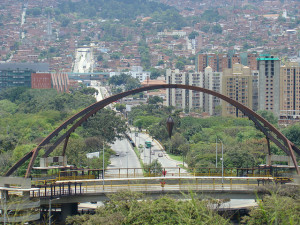 Bridge in Medellin. The plumb bob in the middle supposedly marks the center of the city.